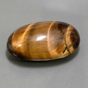 26.13캐럿 천연 골드 브라운 Tiger's Eye, 타원형 컷, 24.8×15.3 mm, 불투명체