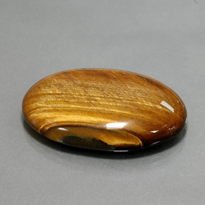 68.47캐럿 천연 골드 브라운 Tiger's Eye, 타원형 컷, 39.2×27.1 mm, 불투명체