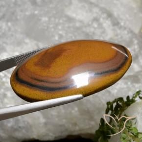 92.65캐럿 천연 웜 브라운 Tiger's Eye, 타원형 컷, 40.8×29.4 mm, 불투명체