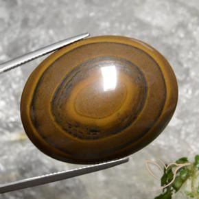 89.36캐럿 천연 시더 브라운 Tiger's Eye, 타원형 컷, 34.7×27.1 mm, 불투명체