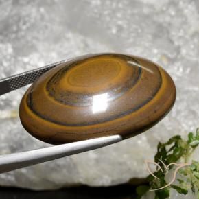 89.36캐럿 천연 시더 브라운 Tiger's Eye, 타원형 컷, 34.7×27.1 mm, 불투명체